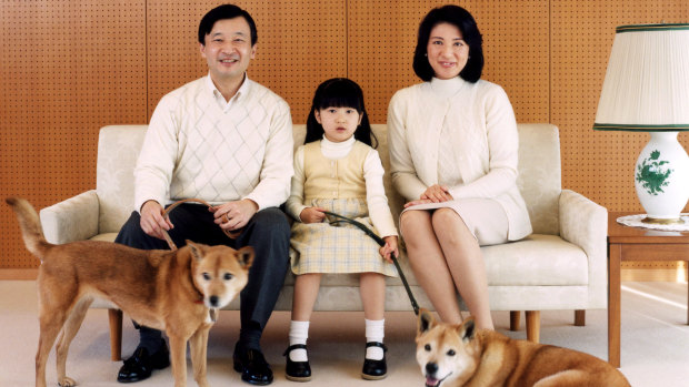 Naruhito, Masako and Princess Aiko with their dogs, Pippi and Mari, in 2007. 