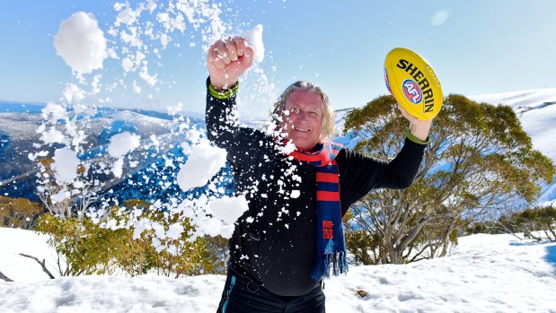 Demons fan Ian White is lapping up the record snowfalls at Hotham Alpine Resort despite Melbourne's footy finals appearance.