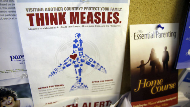 A flyer educating parents about measles is displayed on a bulletin board at a pediatrics clinic in Greenbrae, California. 