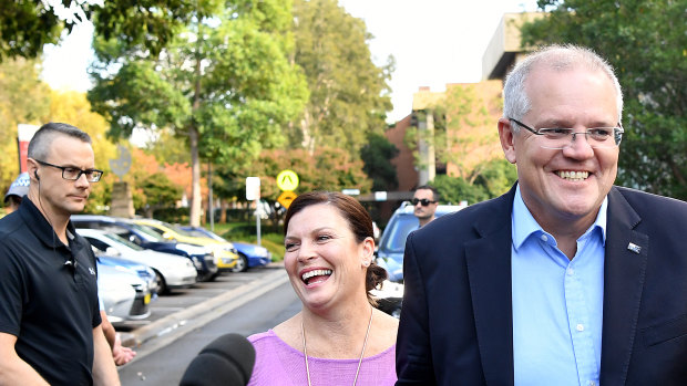 Prime Minister Scott Morrison and wife Jenny speak to the media as they arrive at the Horizon Church in Sutherland, Sydney, on Sunday.