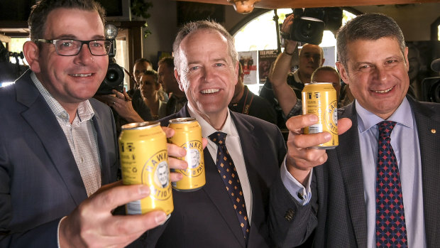 Opposition leader Bill Shorten and Premier of Victoria Daniel Andrews with former Premier Steve Bracks, toast the Labor legend with a Hawke's tinny. 