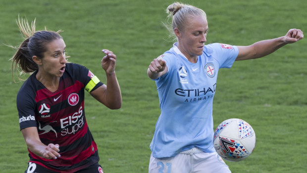 Touch and go: Servet Uzunlar of the Wanderers and Tameka Butt of Melbourne City.
