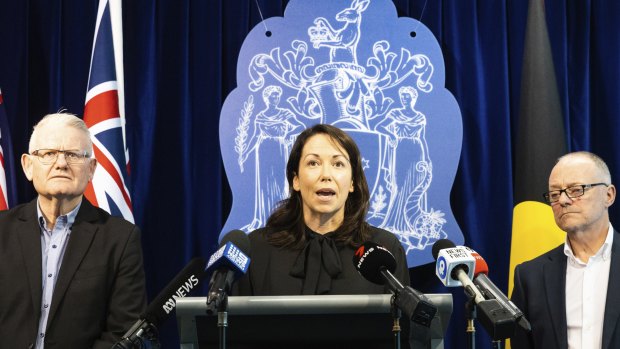 Emergency Services Minister Jaclyn Symes discusses the review into Victoria’s triple-zero operator system, with ESTA boss Stephen Leane (left) and review author Tony Pearce.