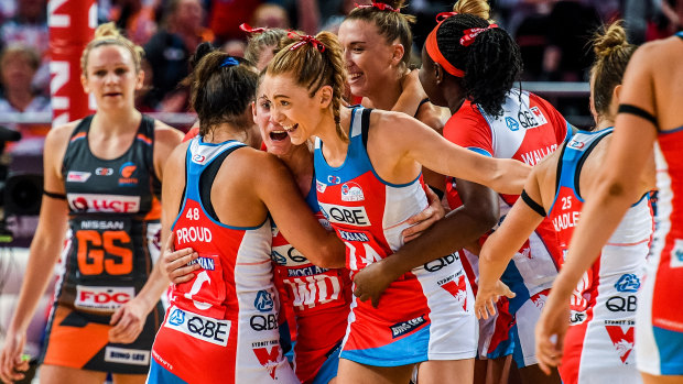 The Swifts celebrate after downing the Giants.