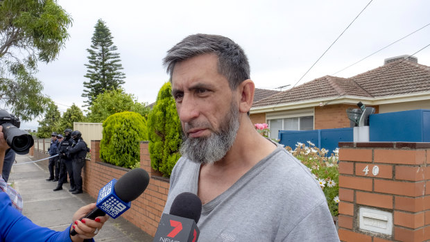 Armagan Eriklioglu, the father of two men arrested on terror charges, speaks to media outside his home.