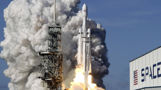 A Falcon 9 SpaceX heavy rocket lifts off from pad 39A at the Kennedy Space Center in Cape Canaveral, Florida.