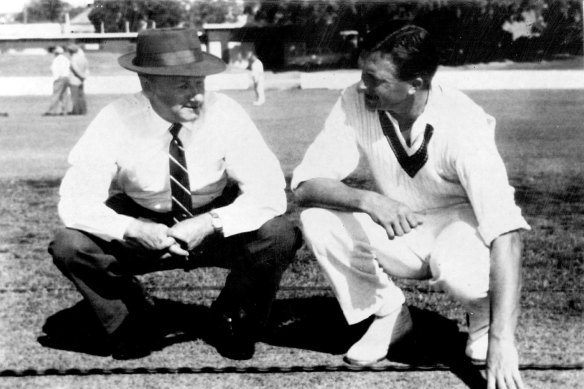 Selector Donald Bradman & Australian captain Richie Benaud inspect a test wicket in 1960.