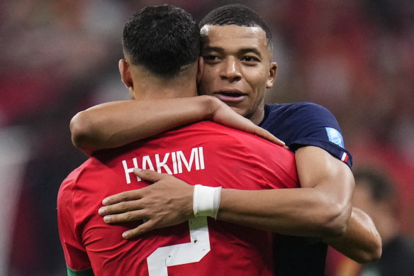 Kylian Mbappe and club teammate Achraf Hakimi hug after the semi-final.