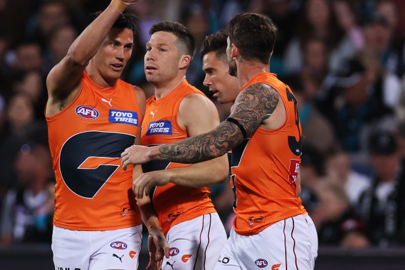 Toby Greene celebrates a goal with Giants teammates during the win over Port Adelaide.