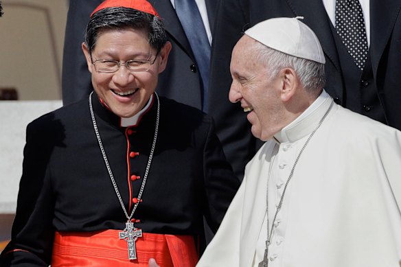 Pope Francis greets Cardinal Luis Antonio Tagle, considered a favourite to be the next pope, in 2017.