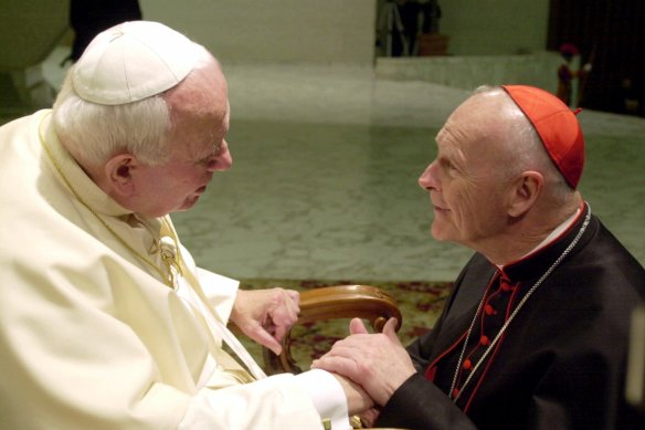 Then archbishop of Washington Theodore Edgar McCarrick, right, greets Pope John Paul II in 2001.