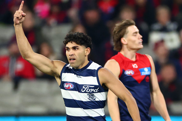 Tyson Stengle of the Cats celebrates kicking a goal.