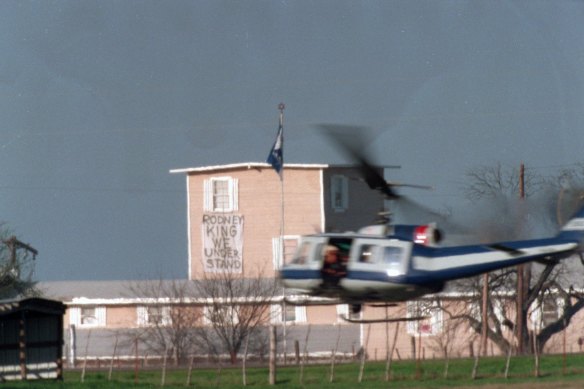 A military helicopter buzzes past the Mout Carmel Branch Davidian compound.