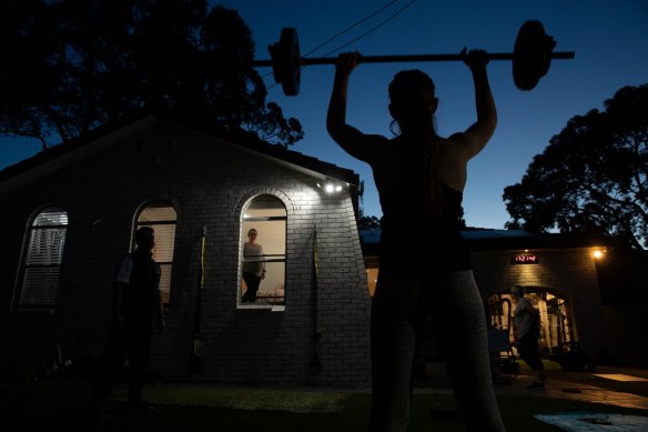 Fitness trainer, Chris Thomas, conducts training sessions in his front yard due to Covid-19 lockdown restrictions.