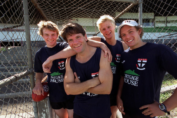 Brendon Goddard (left) with Saints champion Robert Harvey and his fresh-faced teammates Nick Kerry Walter and Luke Ball.
