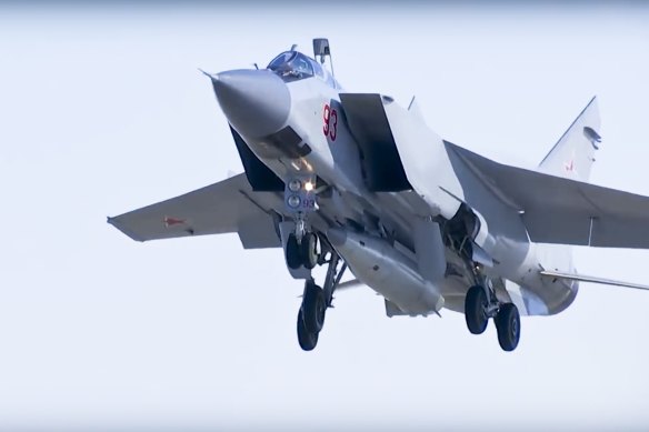 A MiG-31 fighter jet takes off carrying a Kinzhal hypersonic missile.