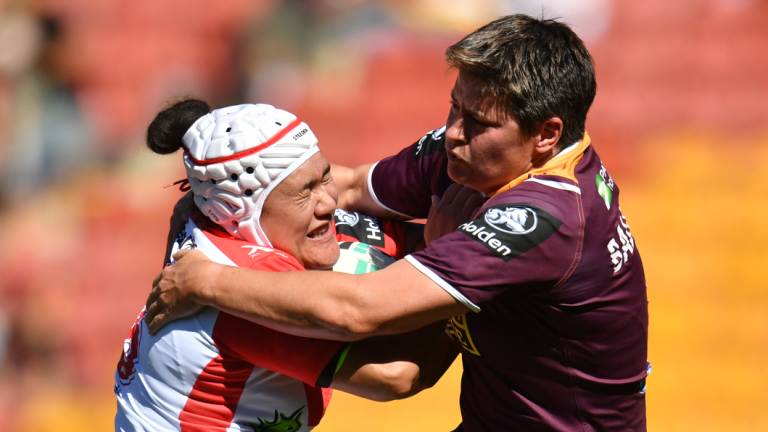 Heather Ballinger (right) tackles the Dragons' Teina Clark during their NRL Women's Premiership match.
