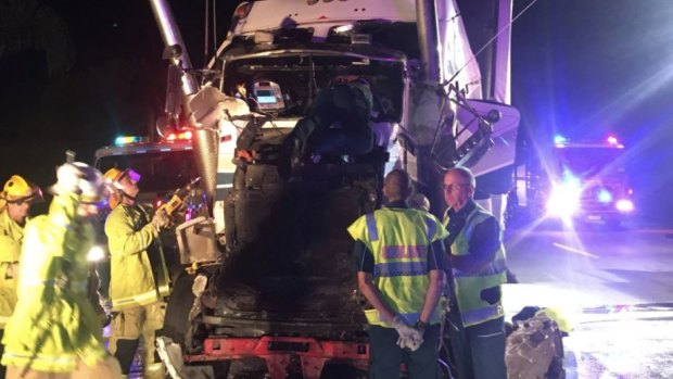 One truck driver was trapped in the wreckage and was cut free by fire crews after a two-truck crash on the M1 southbound in Helensvale.
