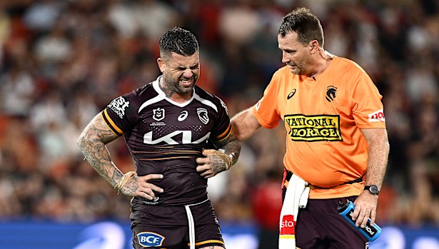 Adam Reynolds leaves the field injured.