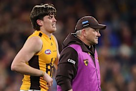 Will Day hobbles off Adelaide Oval.