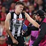 Oscar Steene was assisted by medical staff before leaving the field.