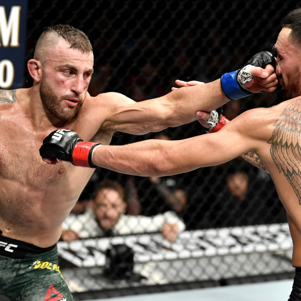 Volkanovski became world UFC featherweight champion after defeating American Max Holloway (right) in 2019.