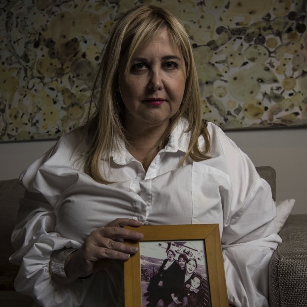Judith Aronovitch holds pictures of her mother Luba.
