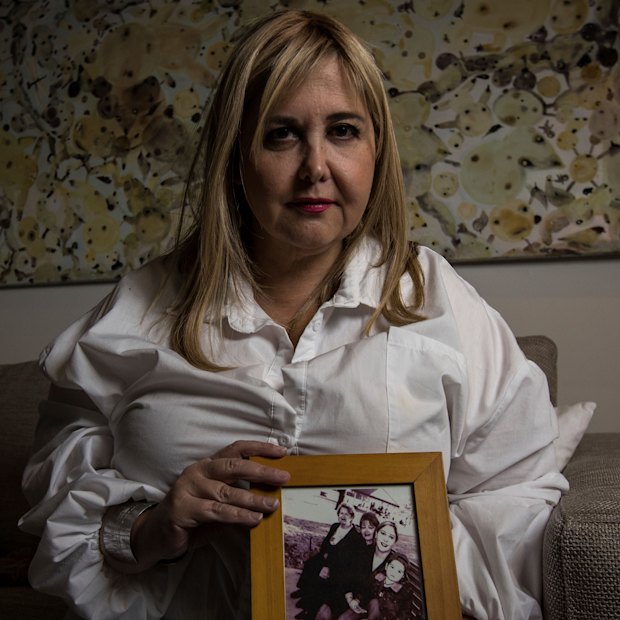 Judith Aronovitch holds pictures of her mother Luba.