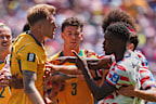 Australia’s Harry Souttar (19), left, and United States’ Folarin Balogun (20), right, argue during their World Cup clash in Seattle.