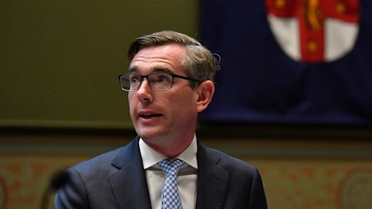 NSW Treasurer Dominic Perrottet delivers the NSW budget to Parliament House in Sydney on Tuesday.
