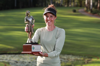 Meghan MacLaren lifts the Australian Ladies Classic trophy at Bonville on Sunday 