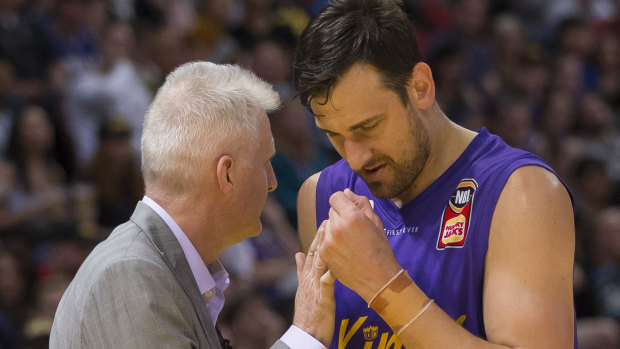 Not the finest start: Andrew Gaze gives Andrew Bogut a consolation pat as he heads to the bench.