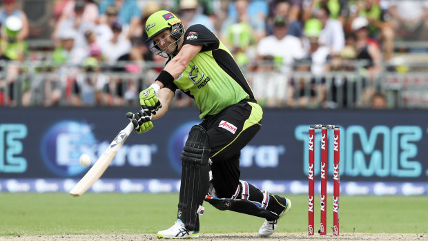 Swinging for the fences: Shane Watson goes over the top against the Strikers at Spotless Stadium.