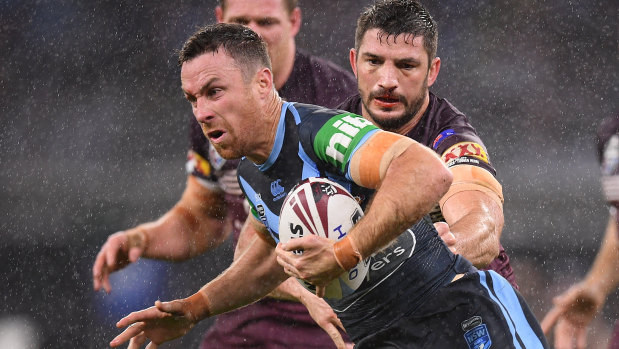 Game breaker: James Maloney charges through the driving rain on his return to the Blues in Perth. 