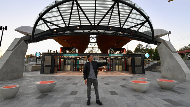 A commuter snaps a selfie outside Hills Showground station on the new Metro Northwest line. 