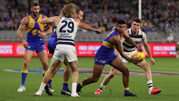 Tim Kelly in action against his former teammates at Geelong, where the WA footballer starred.