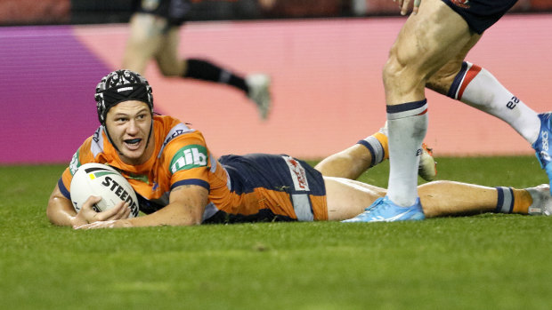 Shining Knight: Kalyn Ponga crosses for another try for Newcastle.