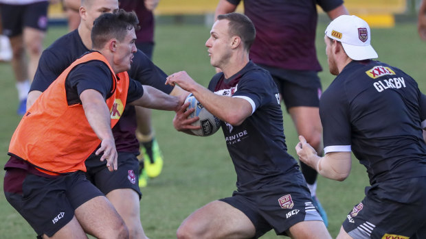 'Intense': Daly Cherry-Evans spots a gap during Maroons training at Langlands Park.