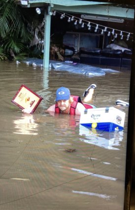 Wakeboard school owner and instructor Scott Kell at height of floodwaters at his Wisemans Ferry property. 