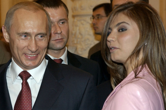Vladimir Putin speaks with Alina Kabaeva in a photo from 2004.