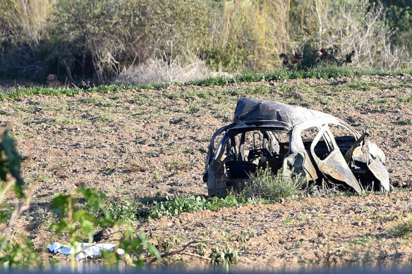 The wreckage of Daphne Caruana Galizia's car was strewn across a field after a powerful car bomb exploded.