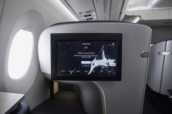 Business class features a large 18-inch entertainment screen.
