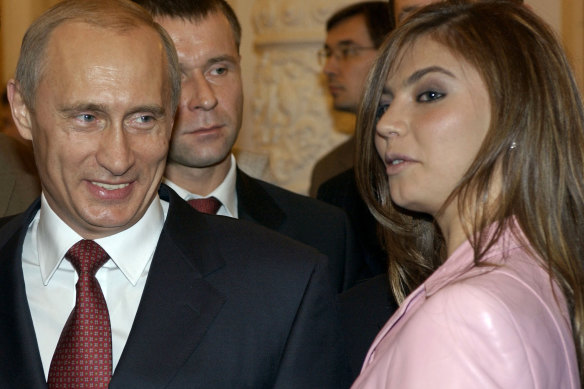 Vladimir Putin speaks with Alina Kabaeva in a photo from 2004.