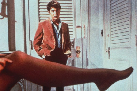 Dustin Hoffman looks over the leg of Anne Bancroft in The Graduate.