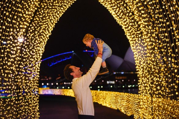 Father and son at the cathedral of light installation in the Royal Botanic Garden as part of Vivid Sydney in 2016.