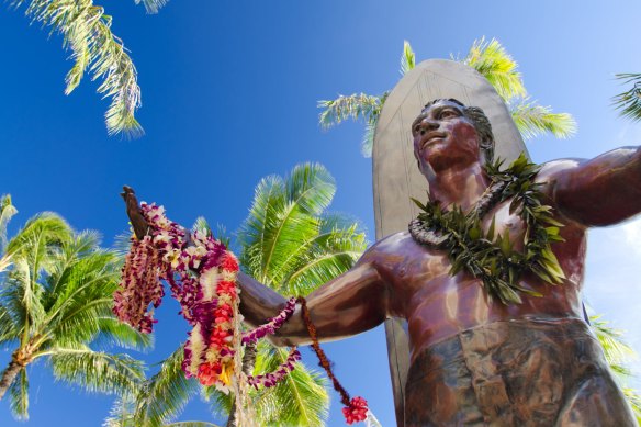The statue of Duke Kahanamoku, the father of modern surfing, near Waikiki Beach.