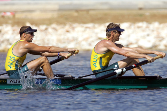 Drew Ginn (left, with James Tomkins) rows in Athens towards a fourth Olympic gold medal.