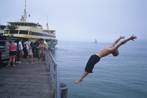 Taking a dive off Manly Wharf.