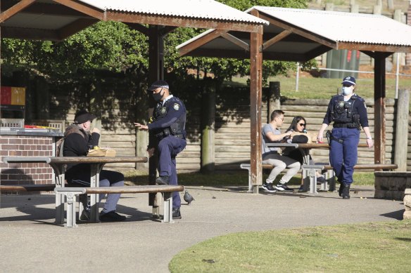 NSW Police patrol Bondi Beach as the city goes into a 14-day lockdown. 
