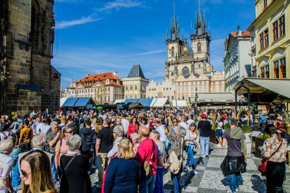 Tourists pack the Old Town Square in Prague.